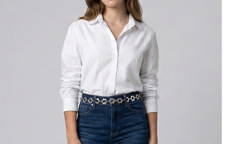 Person wearing a white shirt and blue jeans with a belt on a plain background
