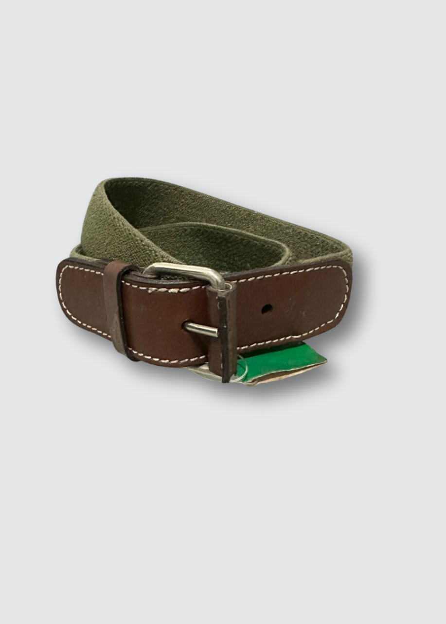 Green belt with brown leather buckle on a light gray background